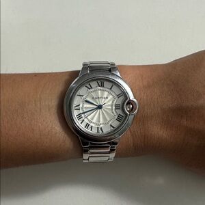 Cartier Silver Timepiece with Blue Accents